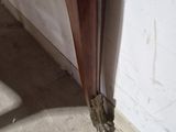 a close up of a bed with a wooden headboard