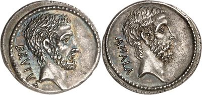a silver coin with an image of a man ' s face on it