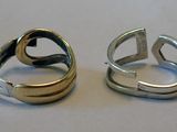 two rings that are sitting next to each other on a table