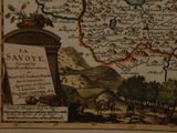 an old map of the country of savoie, with a bird on top of it