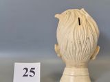 a small figurine of a man with a number 25 on it
