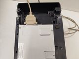 a close up of a laptop computer with a hard drive attached to it