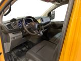 a yellow truck with a steering wheel and dashboard
