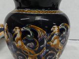 a vase with a lid sitting on a table