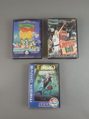 three video games are sitting on a table next to each other