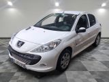 a picture of a small white car parked in a garage