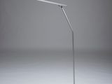 a close up of a lamp on a white surface with a black base