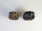 pair of carved figurines of a man and a woman