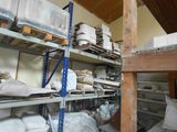 a room filled with lots of boxes and shelves