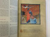 an open book with a picture of a man on a bed