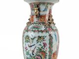 a vase that is sitting on a white surface