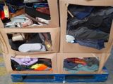 a carton of clothes that is sitting on a pallet