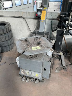 a machine that is sitting on the ground in a garage
