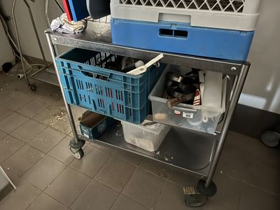 an image of a kitchen with a cart full of items