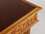 close up view of a wooden table with a black top