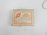 a small box with a stamp and a pair of scissors on it