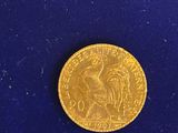 a close up of a gold coin on a blue surface