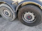 a flat tire on the side of a truck