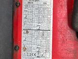 a close up of a red and black box on the ground