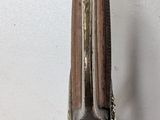 a metal object that is hanging on the wall
