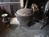 a large pot sitting on top of a stove in a room