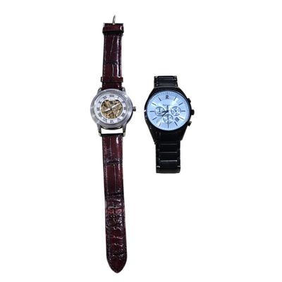 an image of a couple of watches sitting next to each other