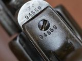 a close up of a gun with a metal handle
