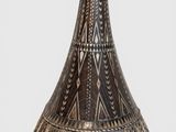 a vase that is sitting on a white surface