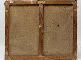 an old wooden frame with a painting on it and a piece of paper