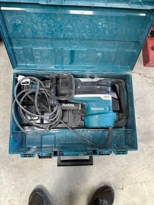 a blue tool box with tools in it on the floor