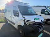a white van that has been vandalized in a parking lot