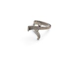 silver ring with a hammer on it on a white surface