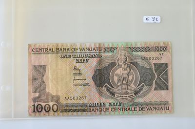 une photo d'un billet de banque sur lequel figure le portrait d'un homme