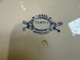 a white plate with a blue and white design on it