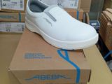a white shoe that is on top of a box