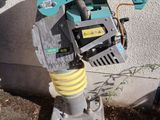a water hose attached to the side of a fire hydrant