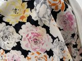 a close up of a purse with flowers on it