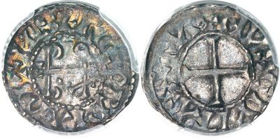 a close up of two silver coins on a white surface