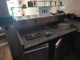 a picture of a counter with a lot of food on it
