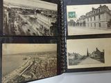 an old photo of a book with pictures of a city in it