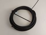 a close up of a black cable on a white surface