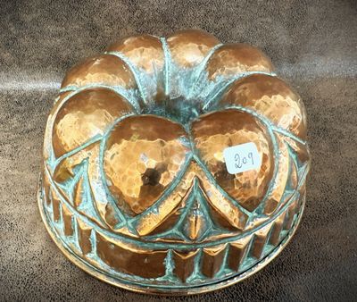 a cake that is sitting on a plate on the floor