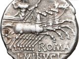 a close up of a silver coin with a horse on it