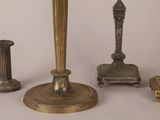 several different types of candles are shown on a white surface