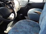 a picture of the inside of a van with blue seats