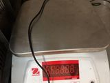 an image of a scale on a kitchen counter