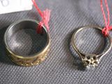 two rings that are sitting next to each other on a table