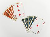 four of a kind of playing cards on a white surface