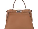 a brown leather handbag on a white background