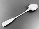 a spoon that is sitting on a table with a spoon in it